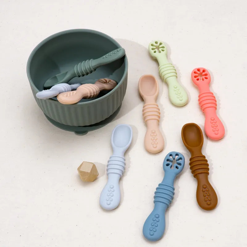 Infant feeding silicone spoons with soft edges, ensuring comfort during baby's first meals.