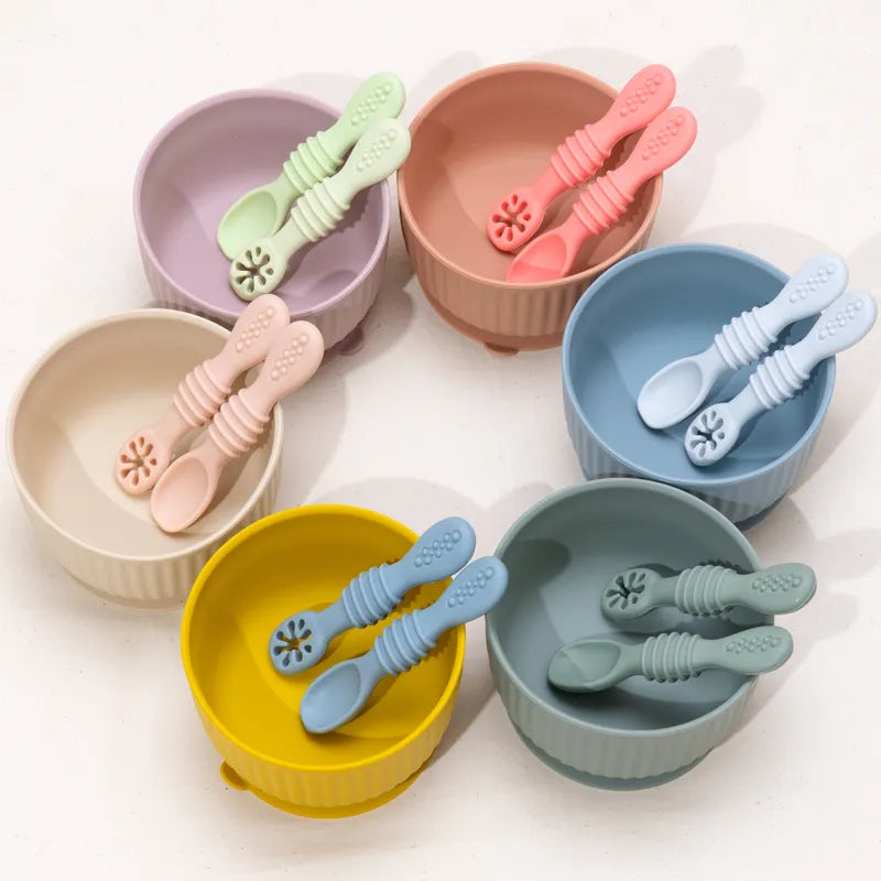 Set of colorful baby silicone spoons, perfect for introducing solids, easy-grip toddler feeding utensil.