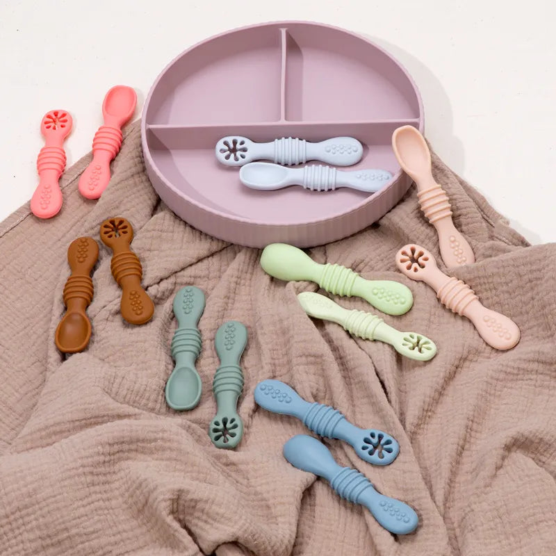 Close-up of soft tip baby spoon, ideal for a baby's first solid food, gentle on gums, BPA-free.