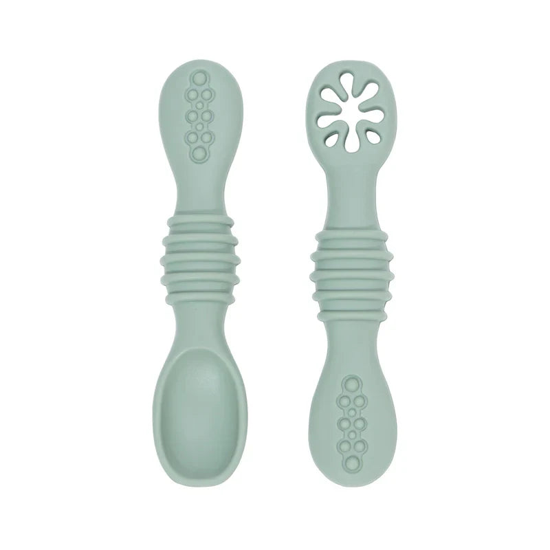 Baby's first feeding set: soft silicone spoons, gentle, BPA-free, promoting safe solid food introduction.