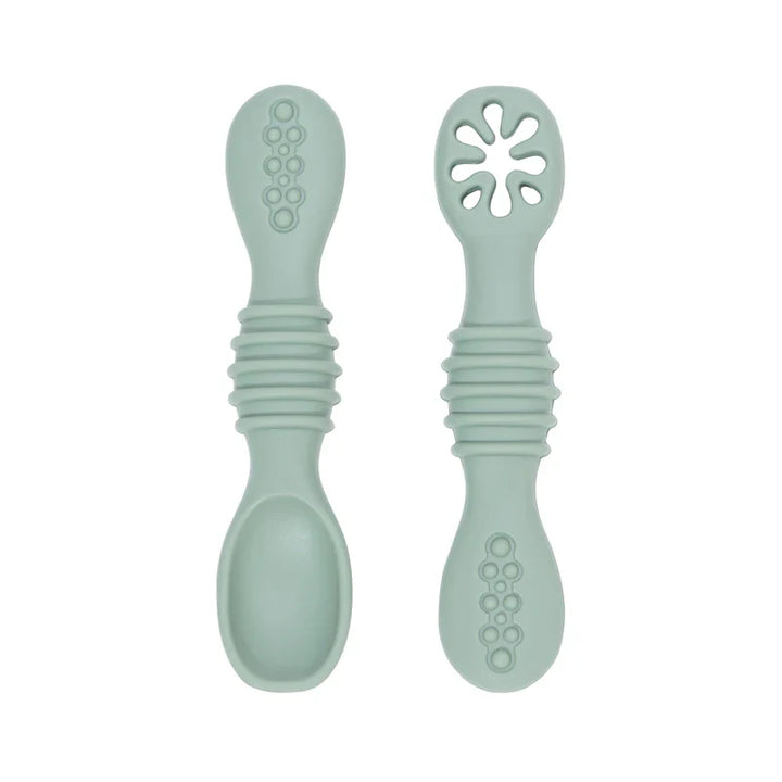 Baby's first feeding set: soft silicone spoons, gentle, BPA-free, promoting safe solid food introduction.