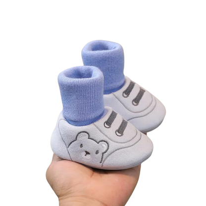 Pair of 'Baby's First Steps' infant booties, soft sole and non-slip for safety