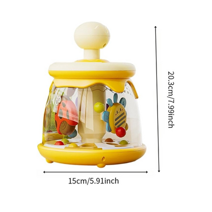 Toddler playing with colorful bug-themed spinner toy for early learning and engagement