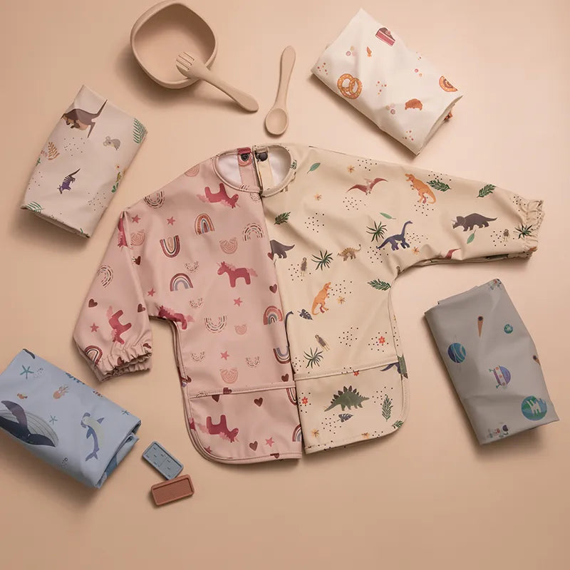 Baby's long sleeve waterproof feeding bib in pastel blue, perfect for messy mealtime