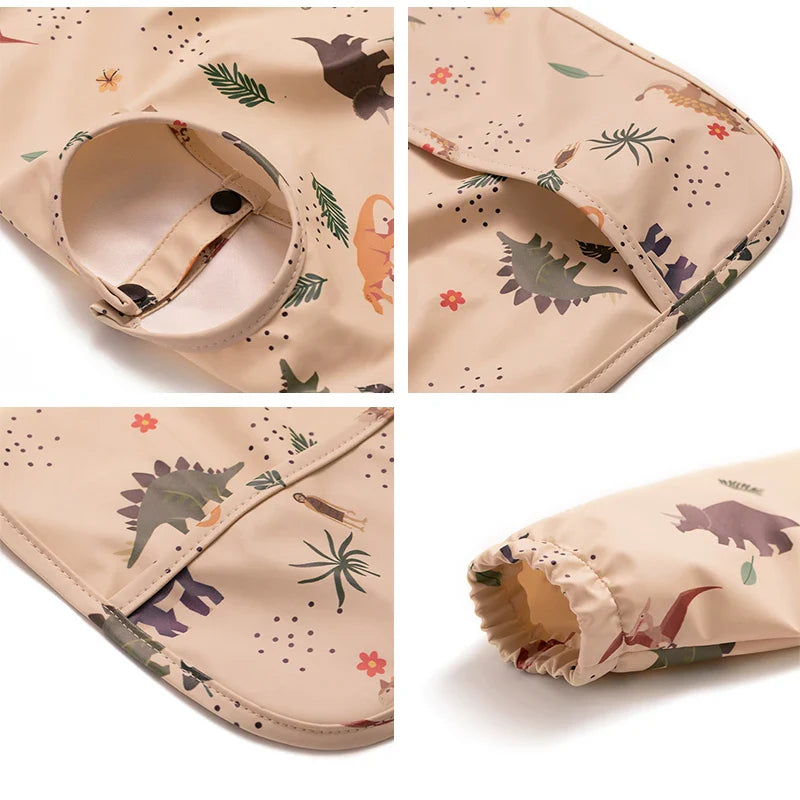 Waterproof long sleeve baby bib with elasticized cuffs, ensuring clean clothes during feeding