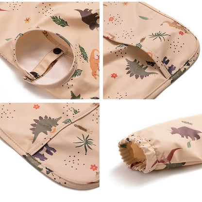 Waterproof long sleeve baby bib with elasticized cuffs, ensuring clean clothes during feeding