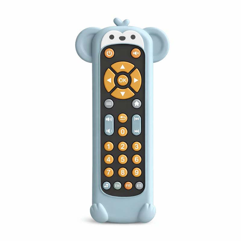 Close-up of a toddler exploring a green musical remote toy with numbers and shapes.
