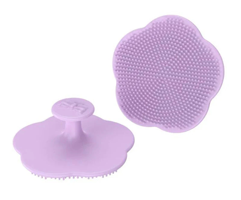 Green silicone infant head brush, perfect for massaging and cleaning delicate baby scalp