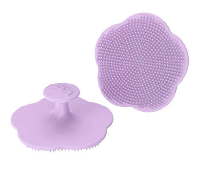 Green silicone infant head brush, perfect for massaging and cleaning delicate baby scalp