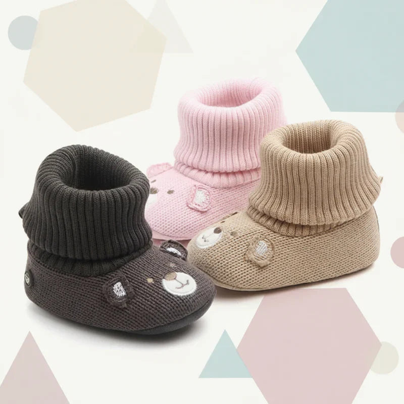 Baby's soft warm non-slip winter booties in a neutral color, perfect for infants.