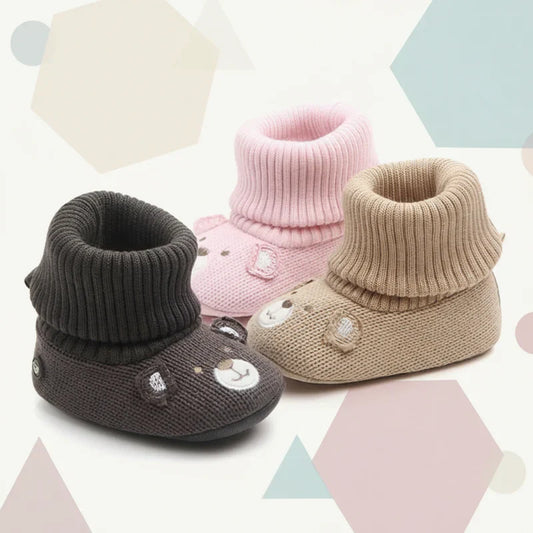 Baby's soft warm non-slip winter booties in a neutral color, perfect for infants.