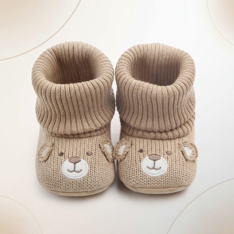 Pair of warm baby winter booties, ideal infant footwear with a soft, non-slip design.