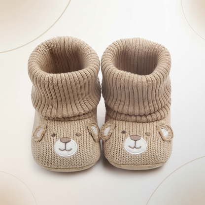 Pair of warm baby winter booties, ideal infant footwear with a soft, non-slip design.