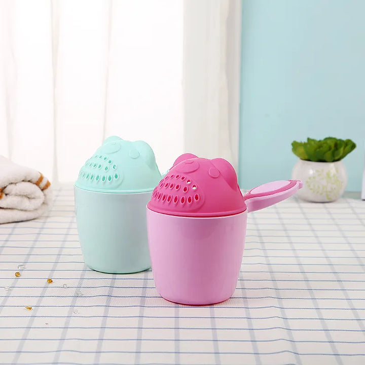 Ergonomic baby bath rinser cup ensures a gentle, tear-free shampoo rinse for infants & toddlers.