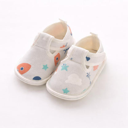 Pair of toddler first walker shoes, featuring a soft grip, cotton construction, and slip-resistant sole for safety.