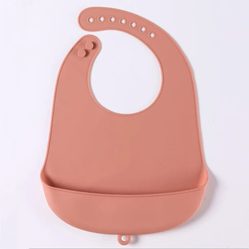 Waterproof silicone bib with adjustable neck fasteners, fits growing babies & toddlers