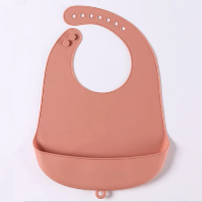 Waterproof silicone bib with adjustable neck fasteners, fits growing babies & toddlers