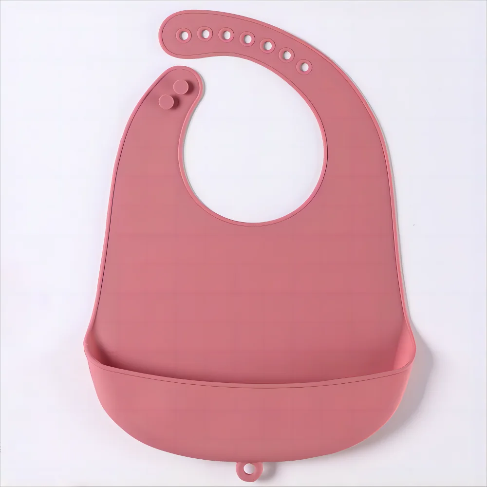 Close up of adjustable snap on a silicone baby bib, ensuring a snug fit