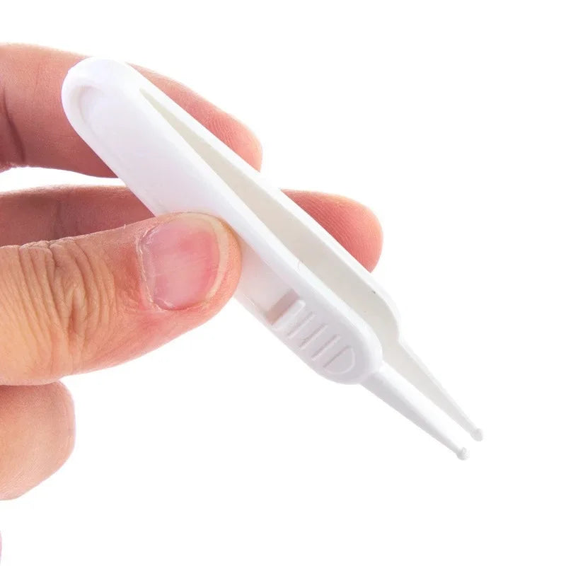 Close-up of baby safe cleaning tweezers, designed for infant nasal care