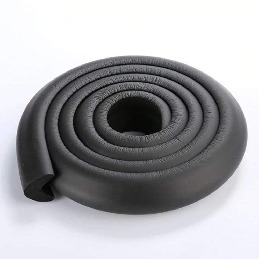 Cushioned corner protector safeguarding sharp furniture edges for baby accident prevention.