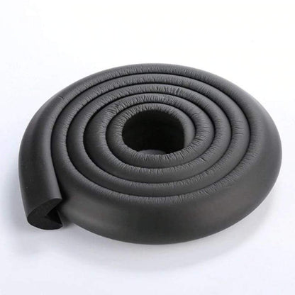 Cushioned corner protector safeguarding sharp furniture edges for baby accident prevention.