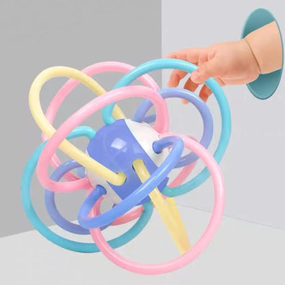 Close-up of Baby Sensory Learning Ball Hand Rattle, showing textured surfaces for tactile stimulation.
