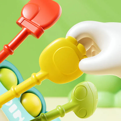 Infant teething toy with multiple silicone strings, perfect for developmental play and sensory stimulation.