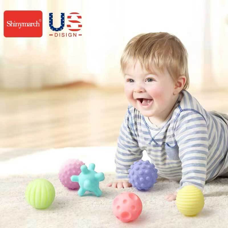 Assortment of soft grip sensory balls in various shapes, ideal for baby motor skills