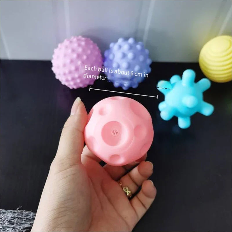 Multi-colored baby sensory grip ball, floating in water, perfect for bath toy collection