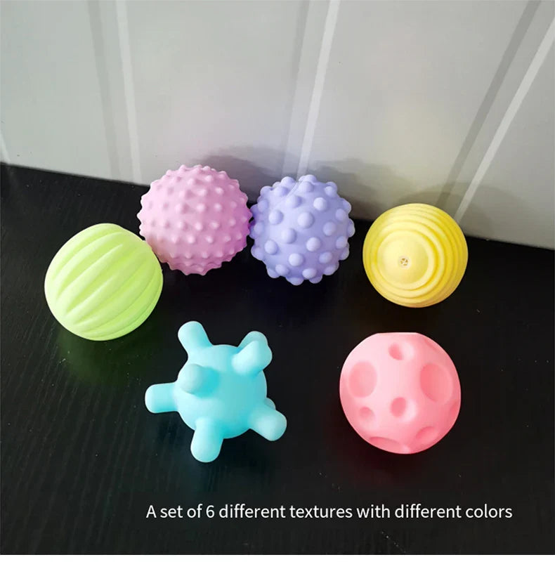 Sensory rubber ball for babies, designed for easy gripping during bathtime activities