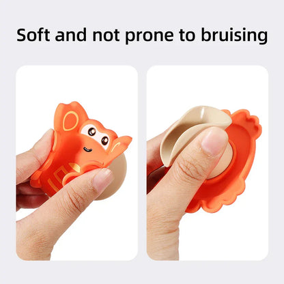 Developmental baby spinner toy attached to a high chair tray, aiding focus and stress relief