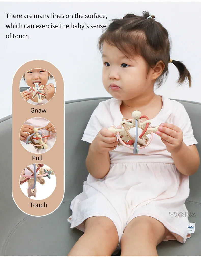 Baby teether ball toy with rattle and sensory nubs, promoting infant development