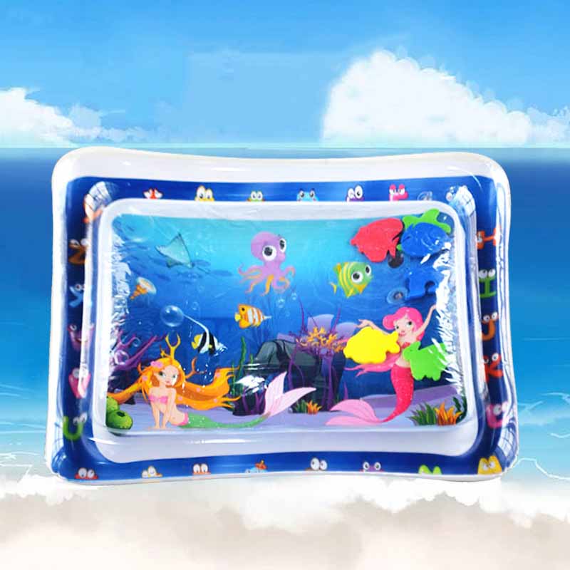 Baby on a sensory water mat, looking at a colorful fish floating inside, enhancing visual tracking