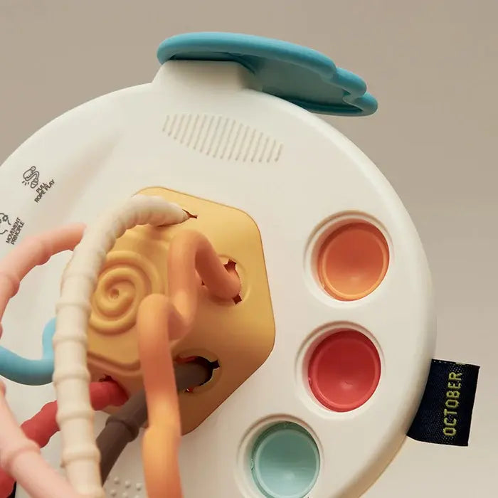 Brightly colored BPA-free baby activity toy in a UFO design, perfect for sensory exploration