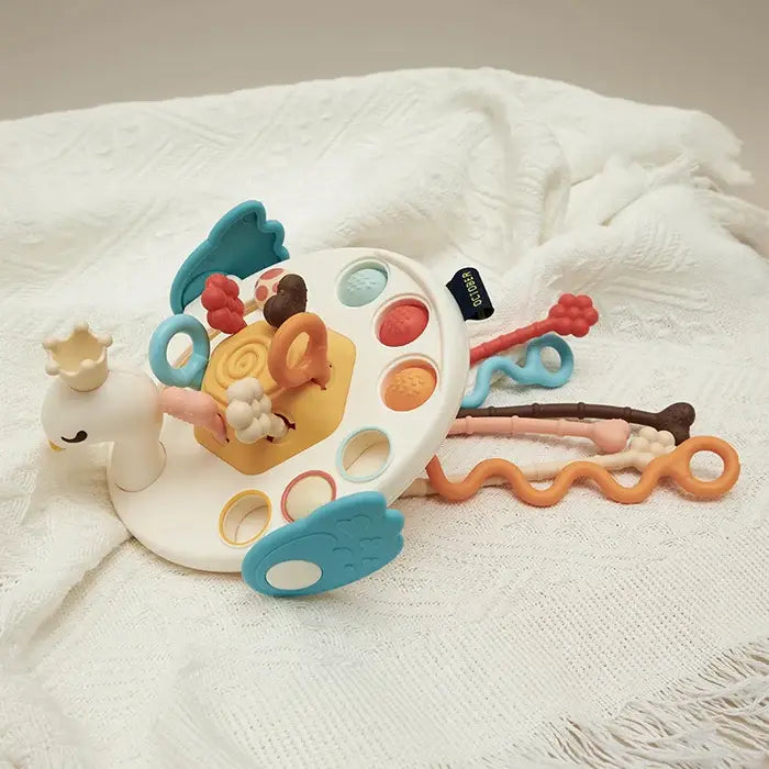 UFO teether toy with various textures for oral stimulation, aiding baby's developmental growth