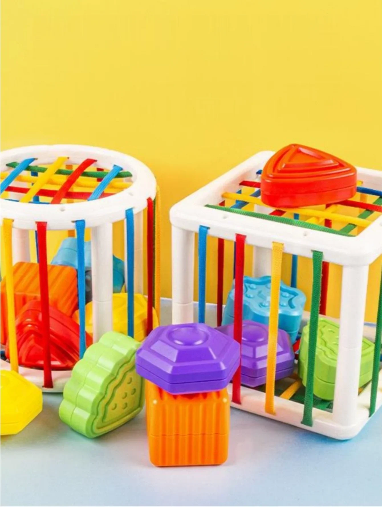Baby enjoying a Shape Sorter Cube, a fun way to improve early learning skills
