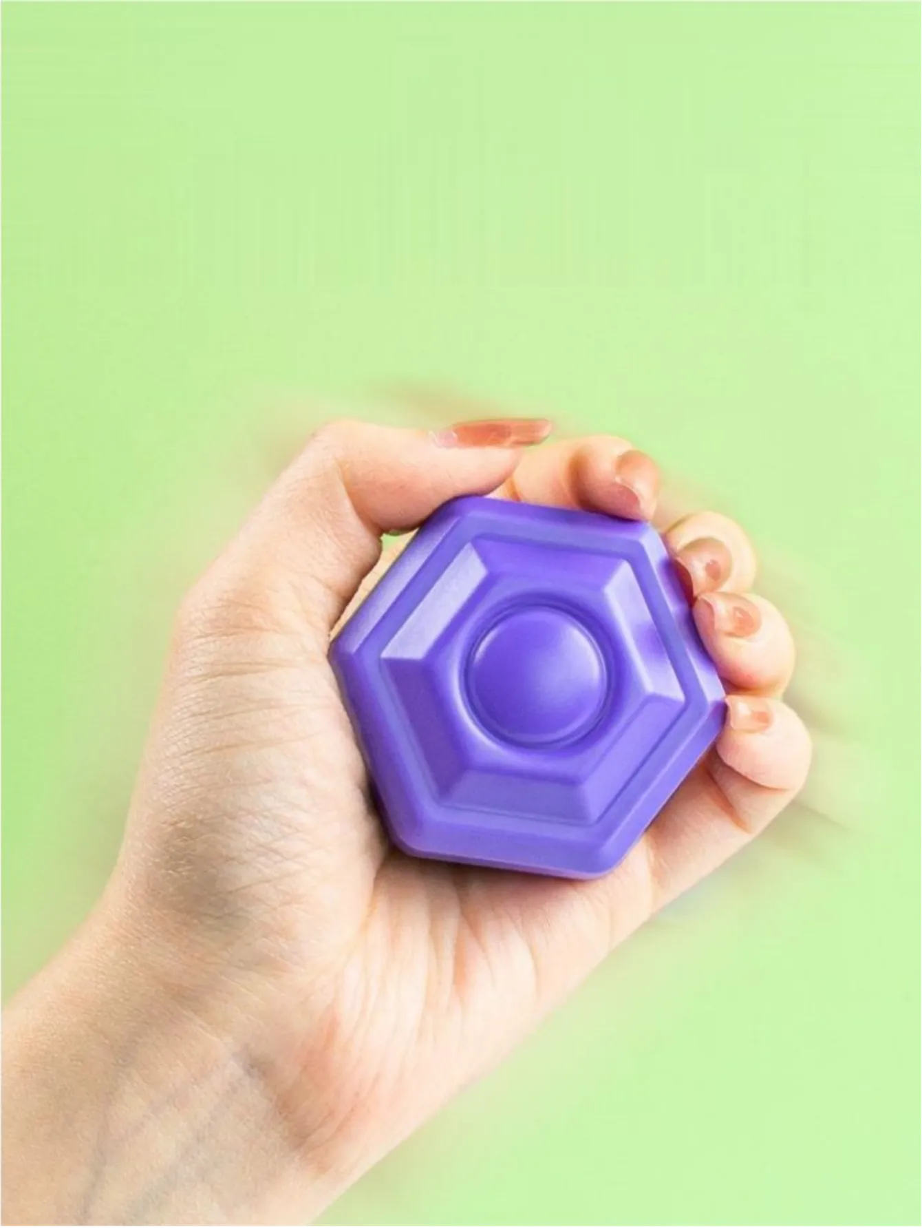 Baby reaching for a colorful shape, about to play with the Sorter Cube, early learning