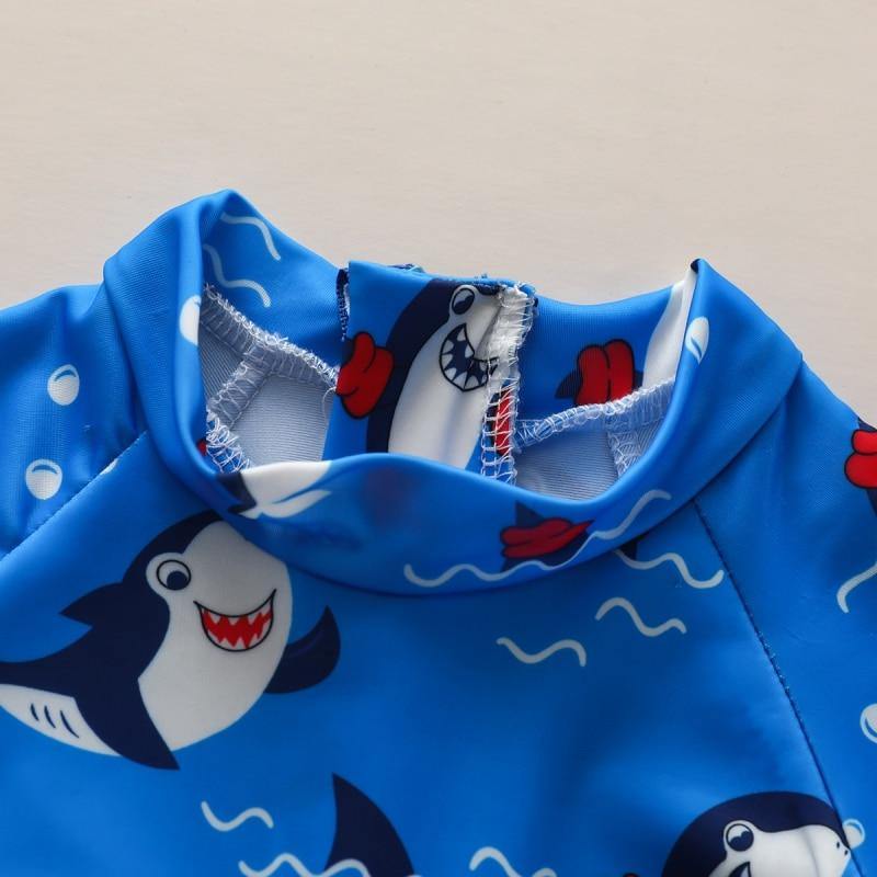 Infant Baby Shark bathing suit in blue. Adorable and comfortable swimwear for toddlers, perfect for summer fun.