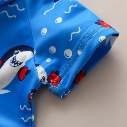 Blue Baby Shark toddler beachwear. Cute & easy-change infant swimwear, great for sunny summer adventures.