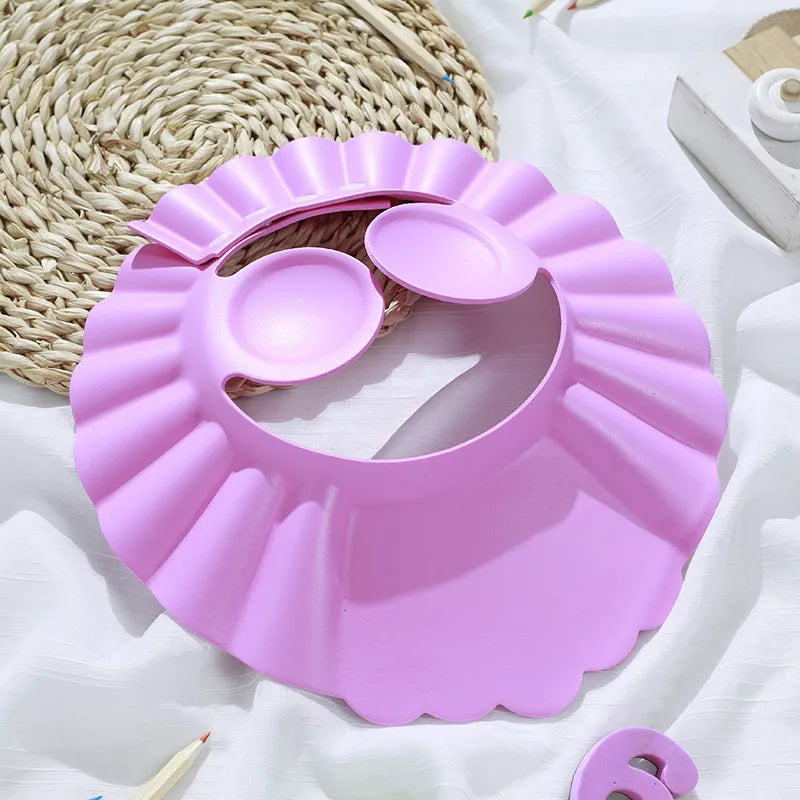 Baby's waterproof ear protection shower cap. Fun design for a stress-free shampoo experience.