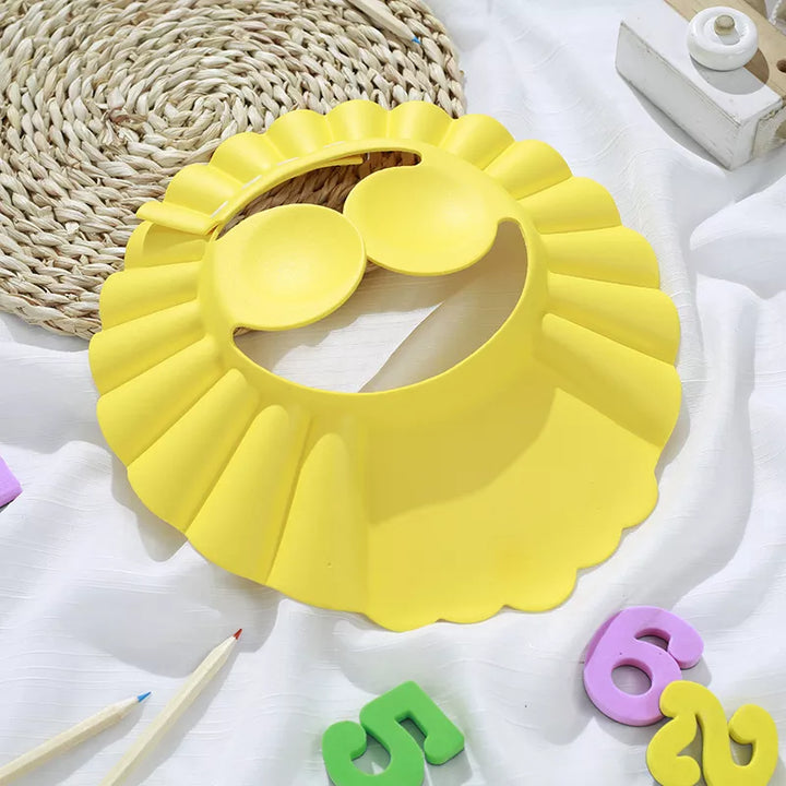 Adjustable baby shampoo shield with ear covers. Keeps soap & water out of eyes & ears for infants.