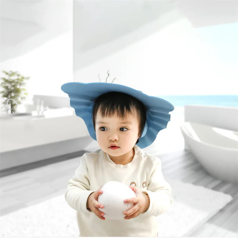 Adjustable infant shower cap with ear protection. For a comfortable & tear-free bath experience.