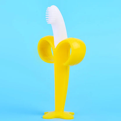 Toddler banana silicone toothbrush teether, designed for easy grip & early dental habits.