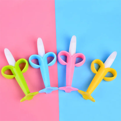 Soft silicone banana teether for babies, doubles as a toothbrush. Soothes gums & cleans teeth.