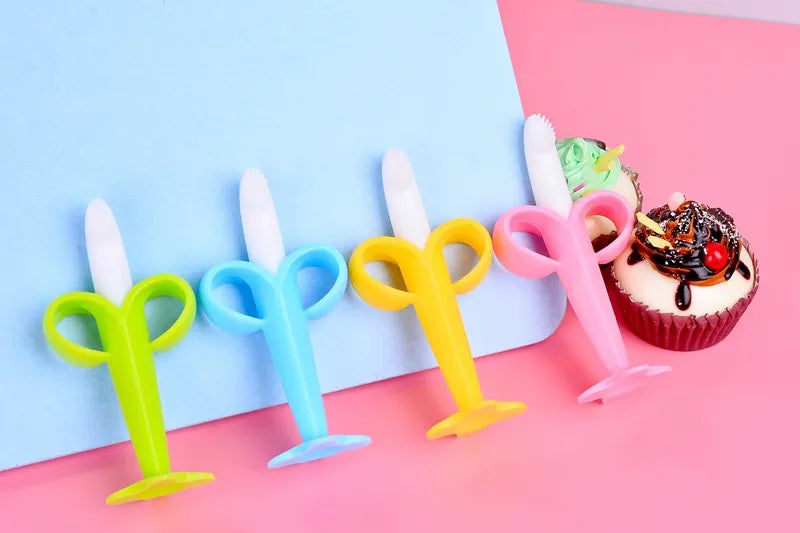 BPA-free baby silicone banana teether toothbrush. Perfect for gum massage, teething, and cleaning.