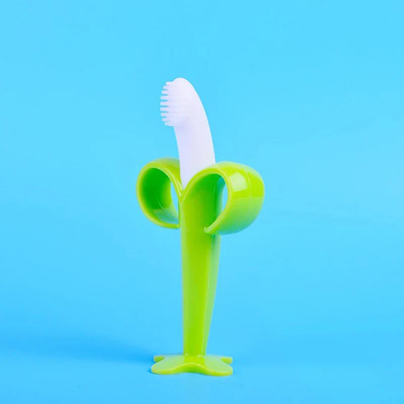 Baby's first toothbrush & teether: a soft silicone banana for gum soothing & oral care.