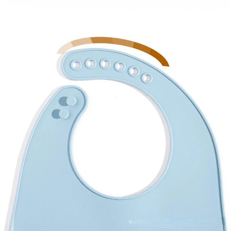 Waterproof infant silicone bib, adjustable for growing babies, mess-free feeding.