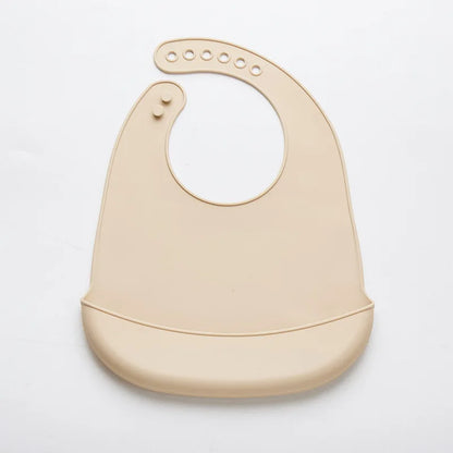 Premium silicone baby bib with deep catch-all pocket, adjustable for infants.