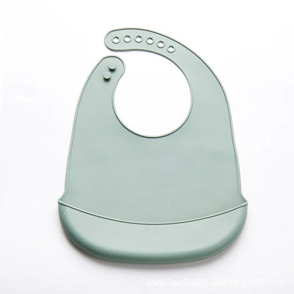 Lightweight baby silicone bib, adjustable snaps for a customized fit, easy to clean.
