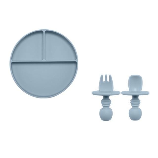 Infant mealtime solution: silicone divided plate and cutlery set in a vibrant blue color